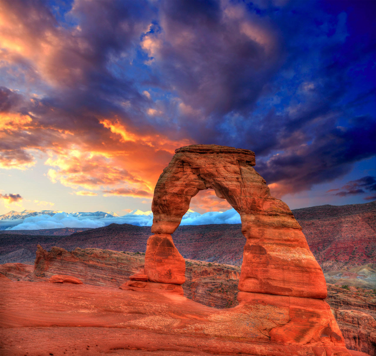 A sandstone arch rock formation in the desert