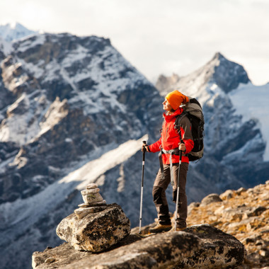 a person standing at the top of a mountain trail